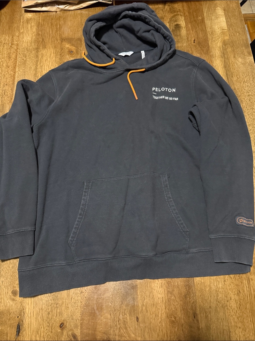 Peloton Black Hoodie with Orange Drawcord